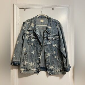 Distressed denim jacket with white stars